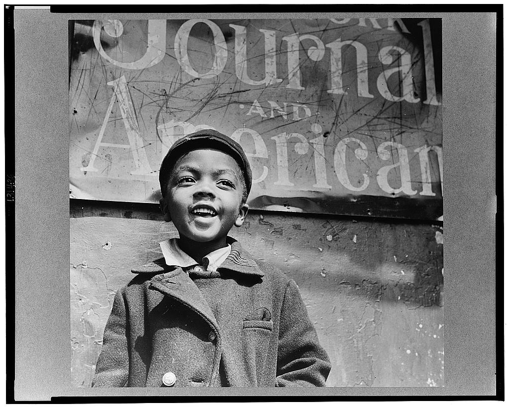 New York, New York. Harlem newsboy