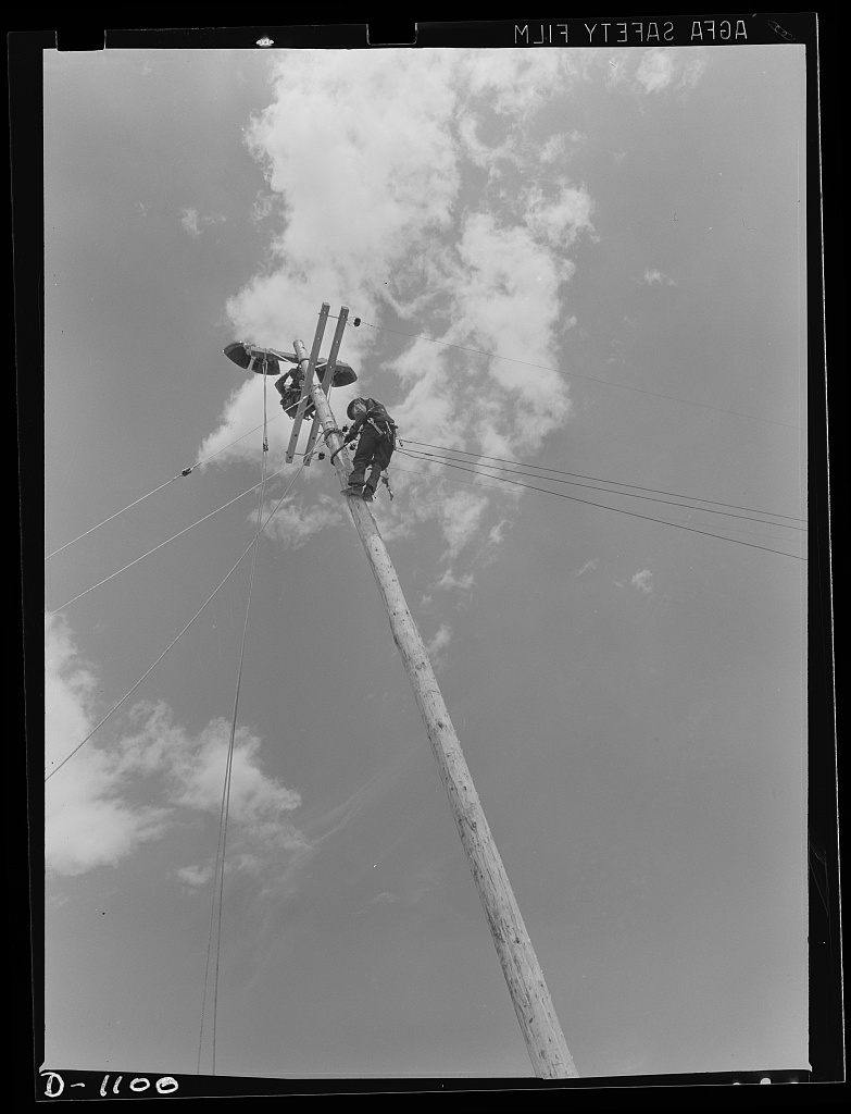 Plant construction. Denver ordnance plant, Denver, Colorado. Lineman bringing power to the ordnance plant at Denver, Colorado, which will produce small arms ammunition