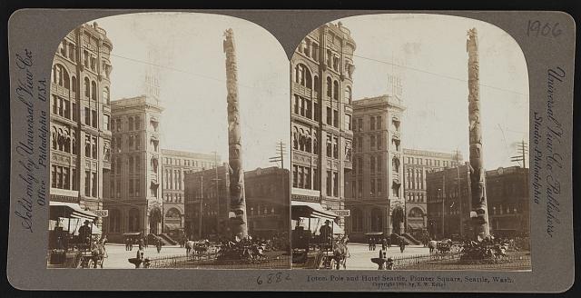Totem pole and Hotel Seattle, Pioneer Square, Seattle Wash.