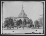 Horse-drawn carriages in front of church