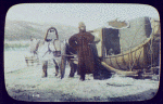 Man standing beside horse-drawn carriage sledge
