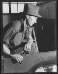 Worker in sugar beet factory. Brighton, Colorado