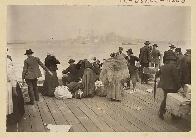 Immigrants waiting to be transferred, Ellis Island, October 30, 1912