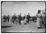Immigrants carrying luggage, Ellis Island, New York