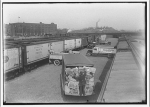 Railroads. Railroad yard with trucks and railroad cars II
