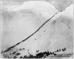 Packers ascending the summit of Chilkoot Pass during the gold rush of 1898
